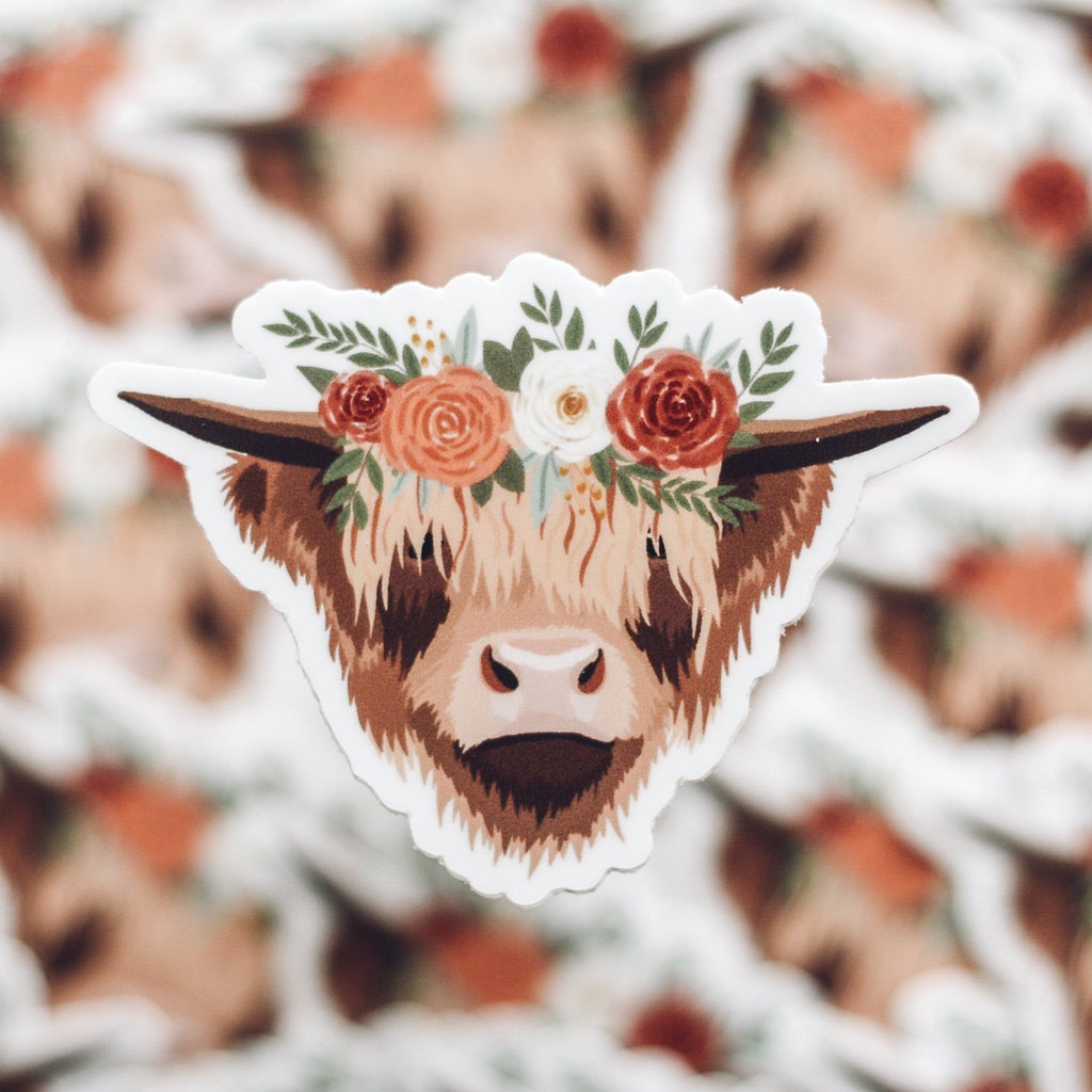 Sticker of brown highland cow wearing a floral crown