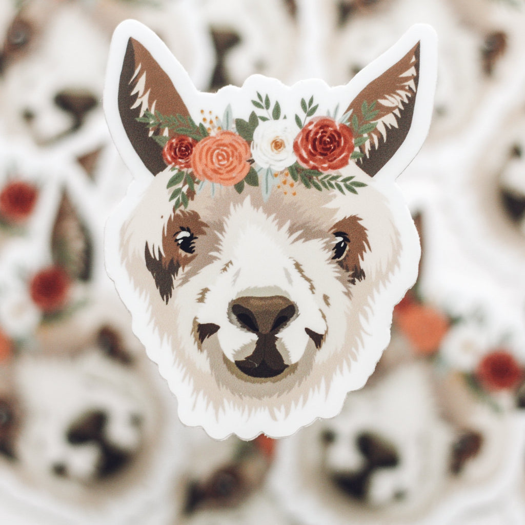 Sticker of white llama wearing a floral crown